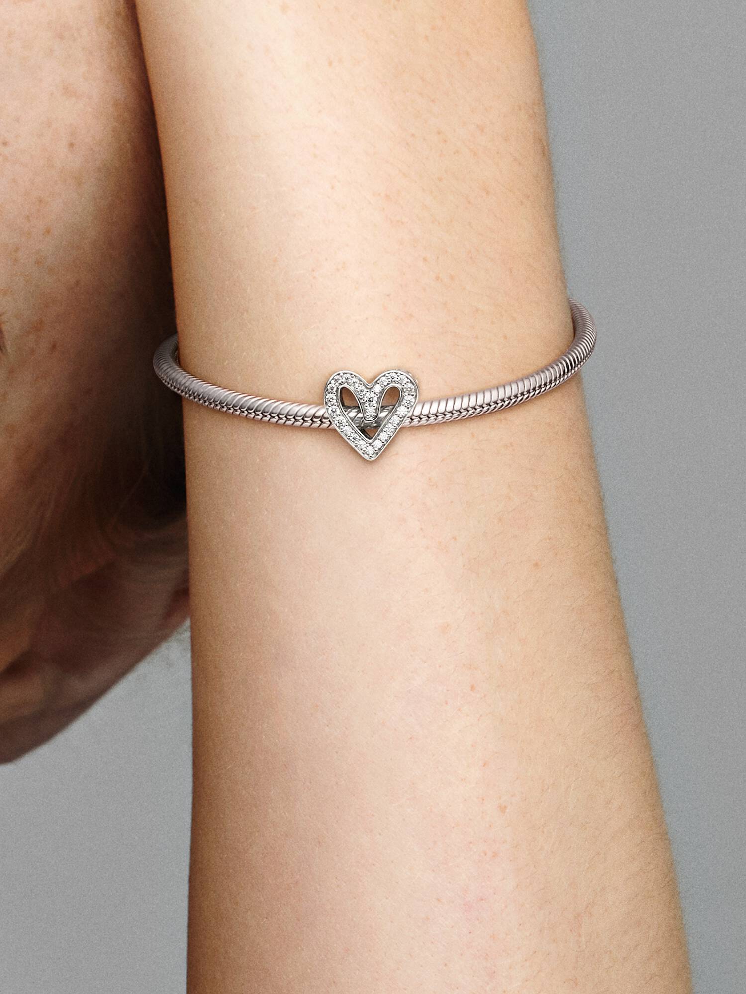 Charm con cuore scintillante